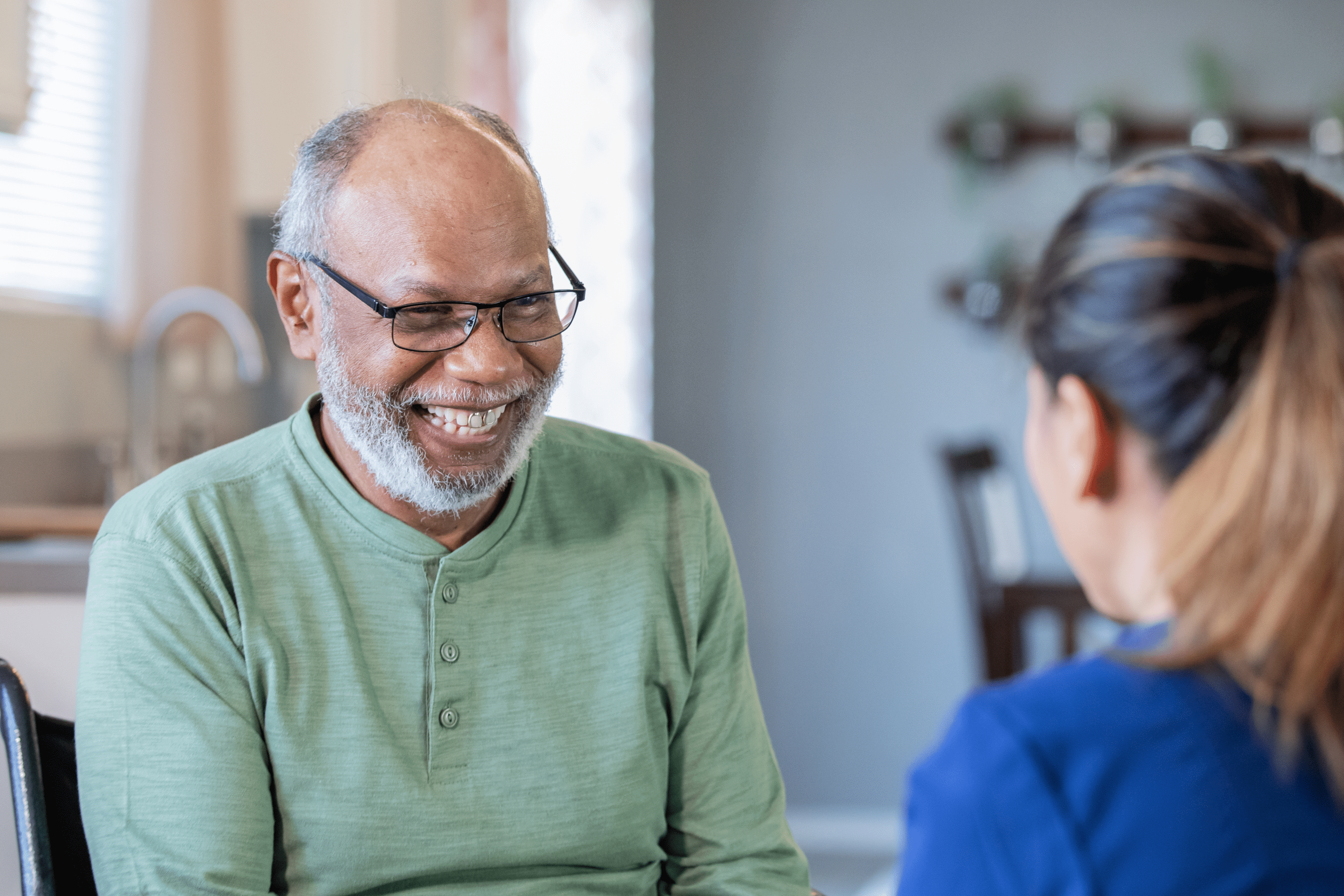 A man with I/DD speaks to his counselor about employment services
