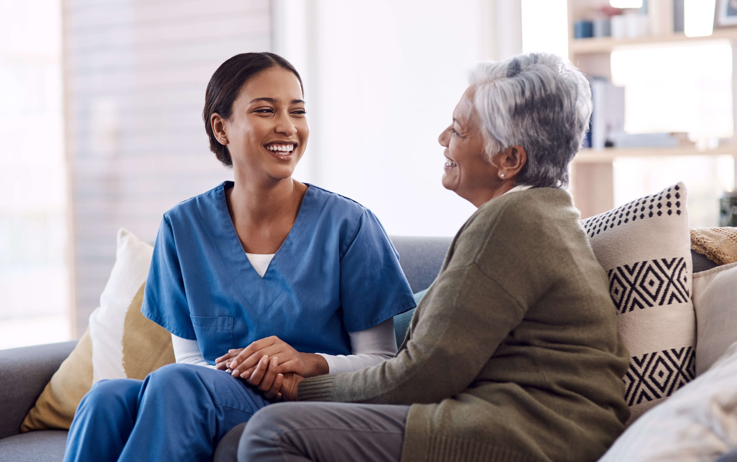 Doctor and elderly women talking and smiling