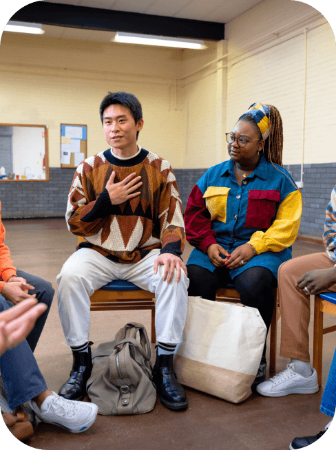 Patients share in a group therapy session