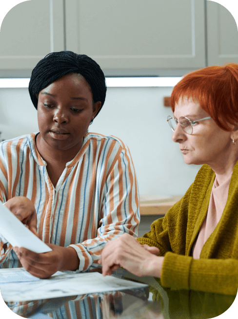 A certified care manager discusses treatments with an older woman