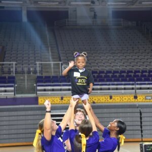 Kindergartener from RHA's care facility attends cheerleading camp