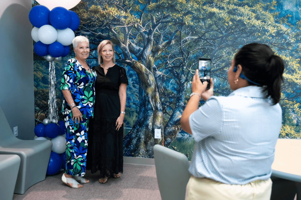 Marti Webb poses with someone for a photo during the FBC open house event